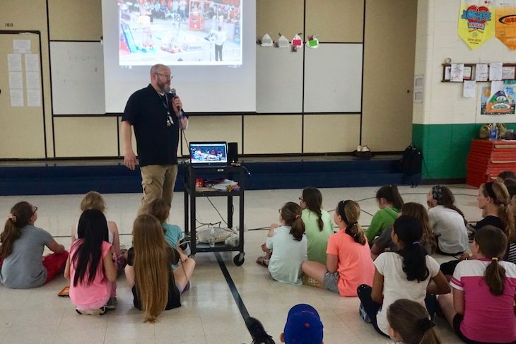 <p>BPS101 Technology Support Specialist Brian Nallenweg/Roaring Robotics “RoboDad” showing fourth-grade students videos from Roaring Robotics competitions.</p>
