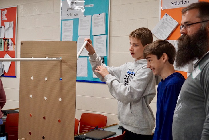 <p>Mr. Saam helping students create additional velocity with a new angle.</p>
