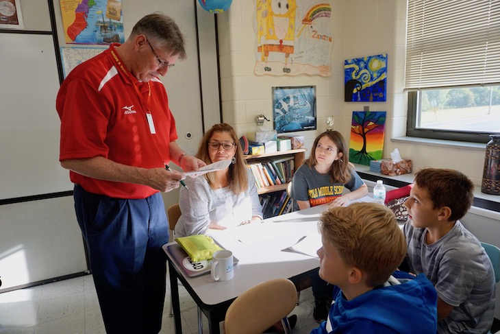 <p>RMS Social Studies Teacher Monika Hubble (second from left) and Science Teacher Gina DeSimone (right) hoping they got an answer right on a quiz.</p>
