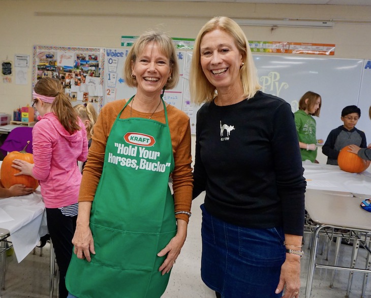 <p>Health/Family & Consumer Science Teacher Laura Abraham (left) helped carve pumpkins in Jody Stoneberg’s (right) science class.</p>
